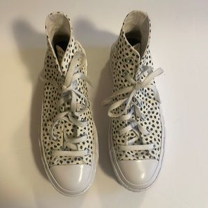 Spotted converse platform high tops.